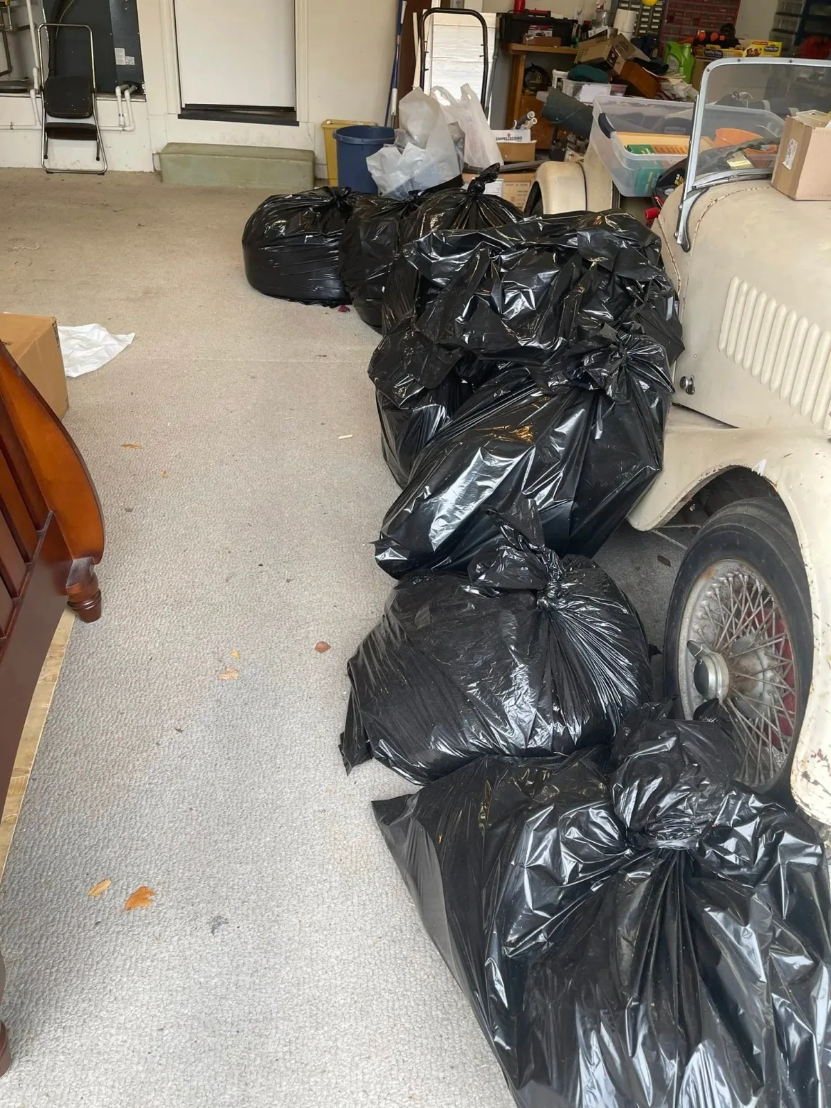 Bagged belongings in a garage or storage space