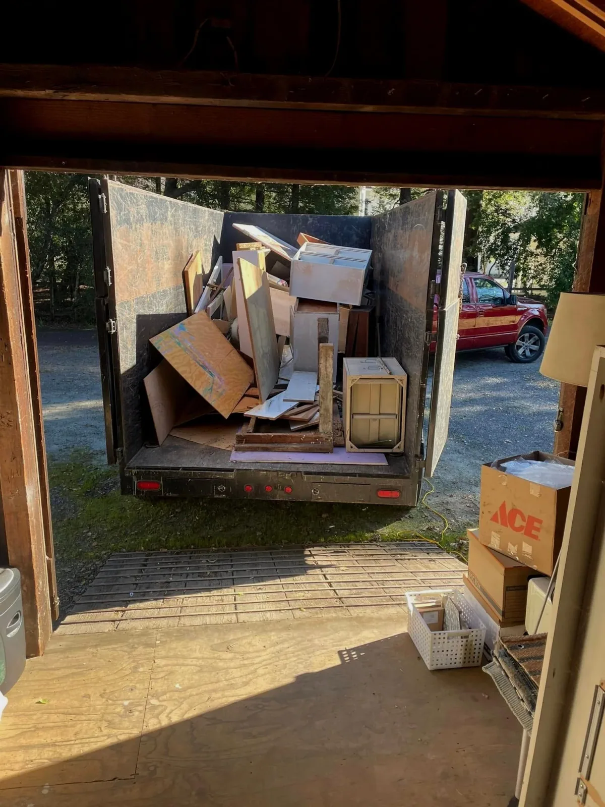 Wood and cabinets loaded into a hauling trailer